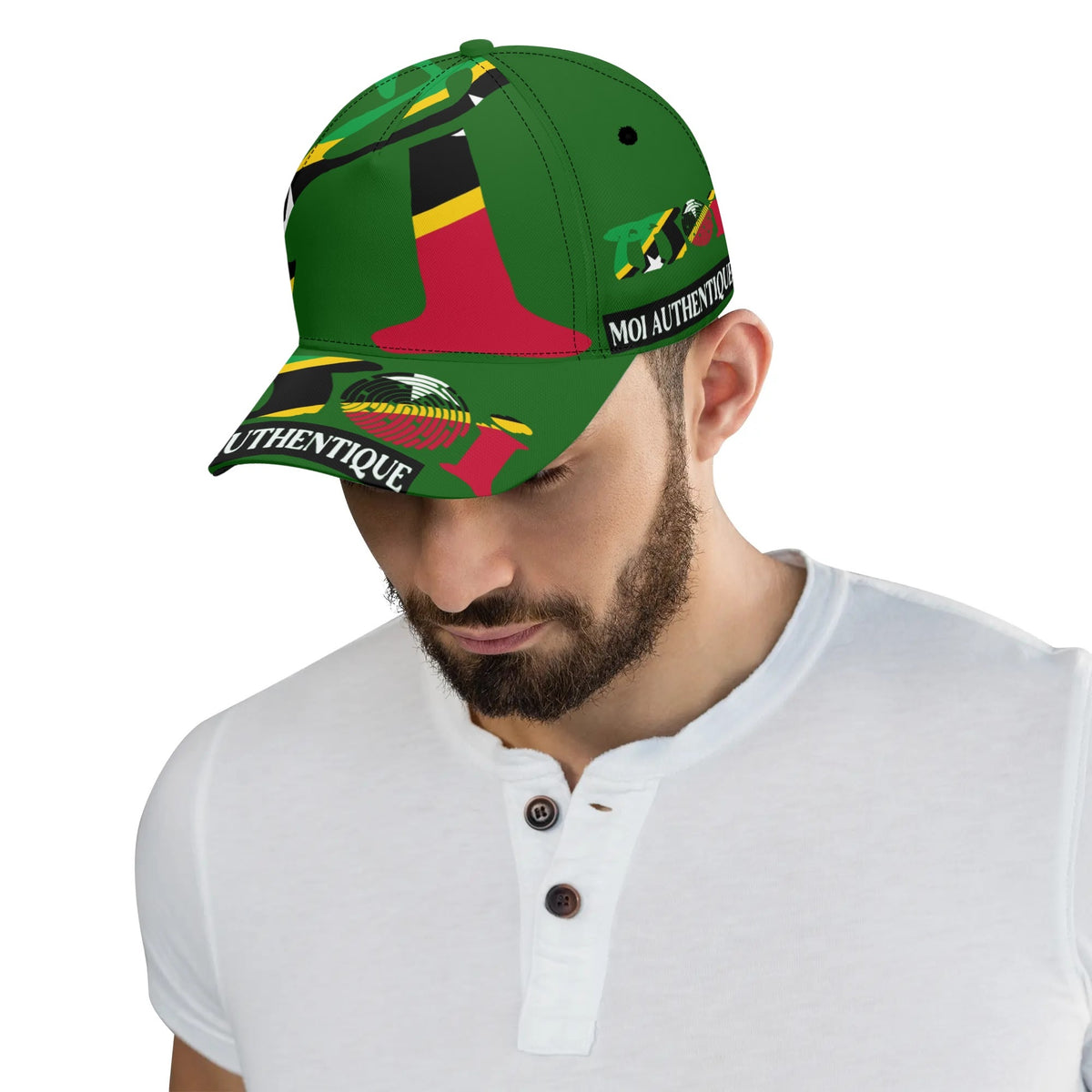 Man wearing a colorful cap with various designs on a white background
