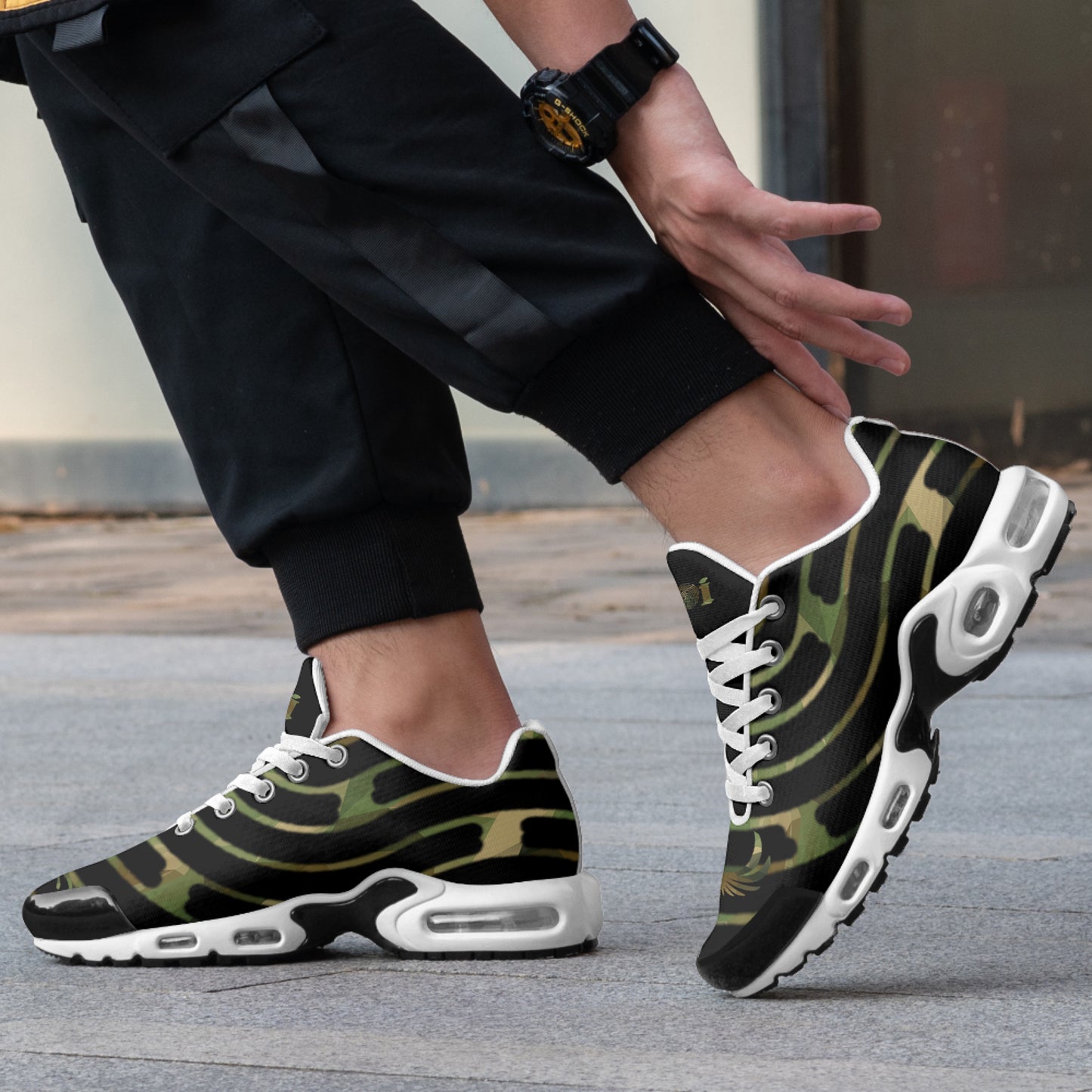 Person wearing camouflage sneakers with white soles on a pavement.
