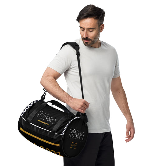 A man carrying a A two-tone, ska-inspired black and yellow gym duffel bag featuring checkered design details and the brand name 'Moi Authentique' displayed prominently.