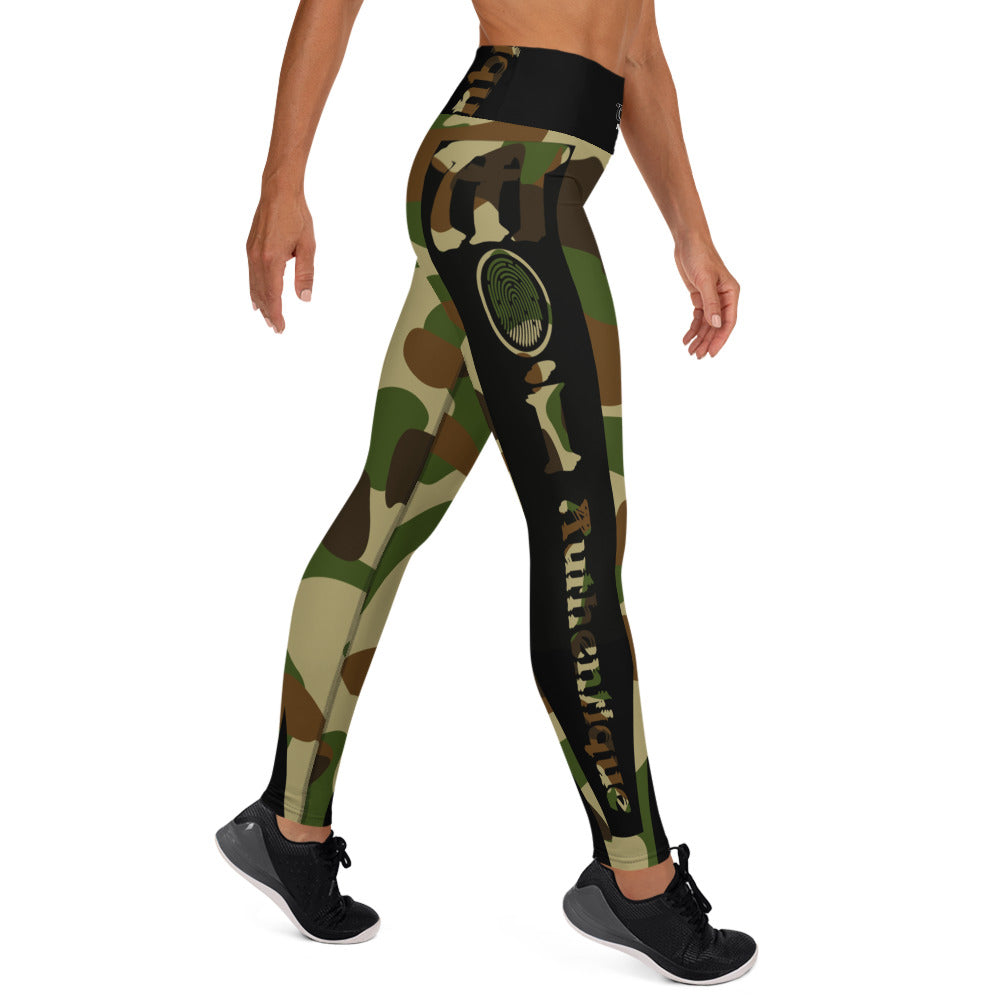 A person in a yoga pose wearing camouflage-patterned yoga leggings.