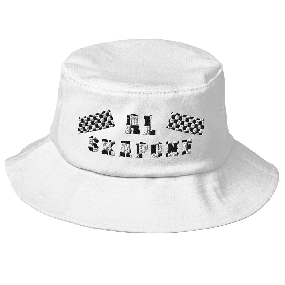 A white hat with black and white embroidery.