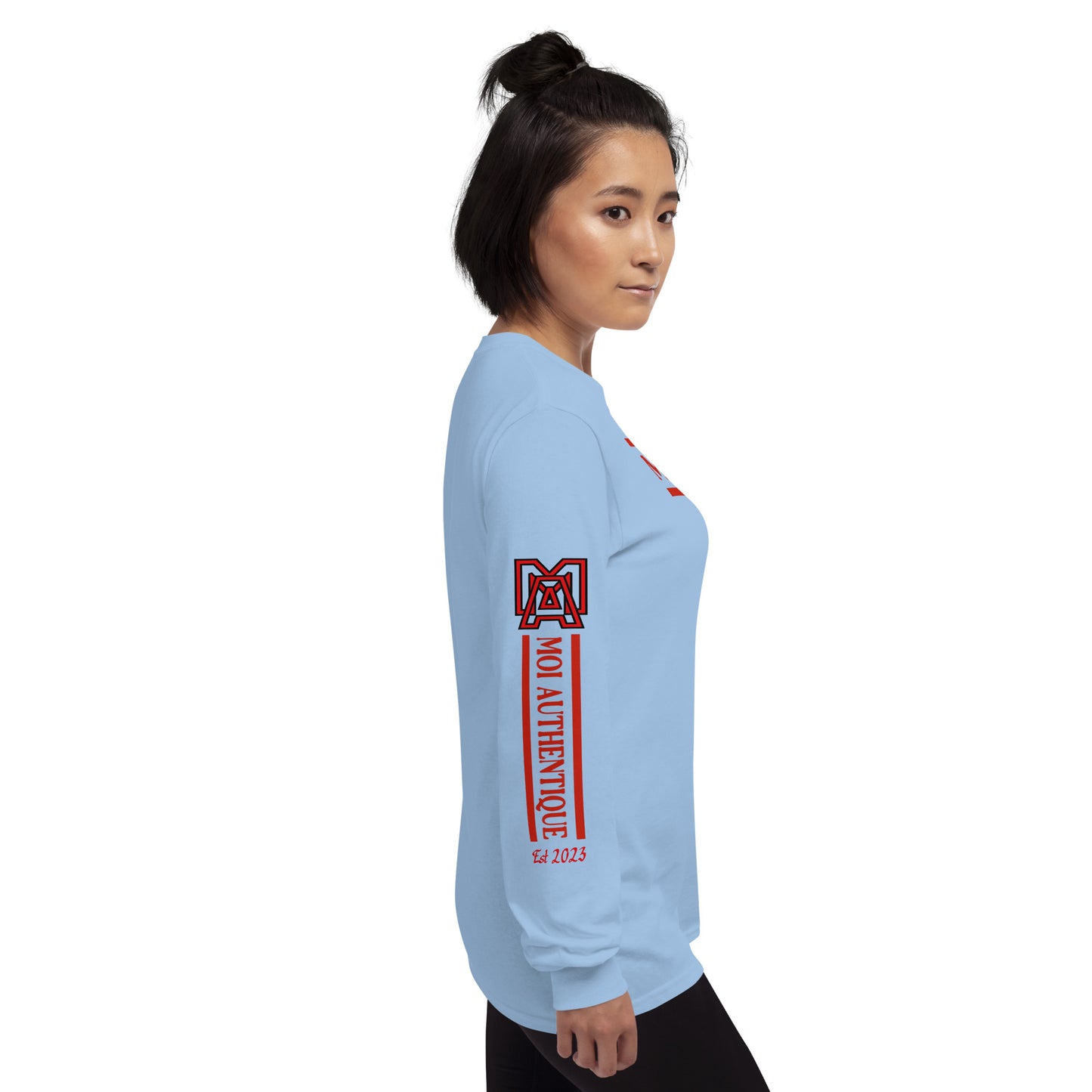 Right side view of a woman wearing a long-sleeved blue shirt with red text and graphics, including the brand name 'Moi Authentique' on the sleeve