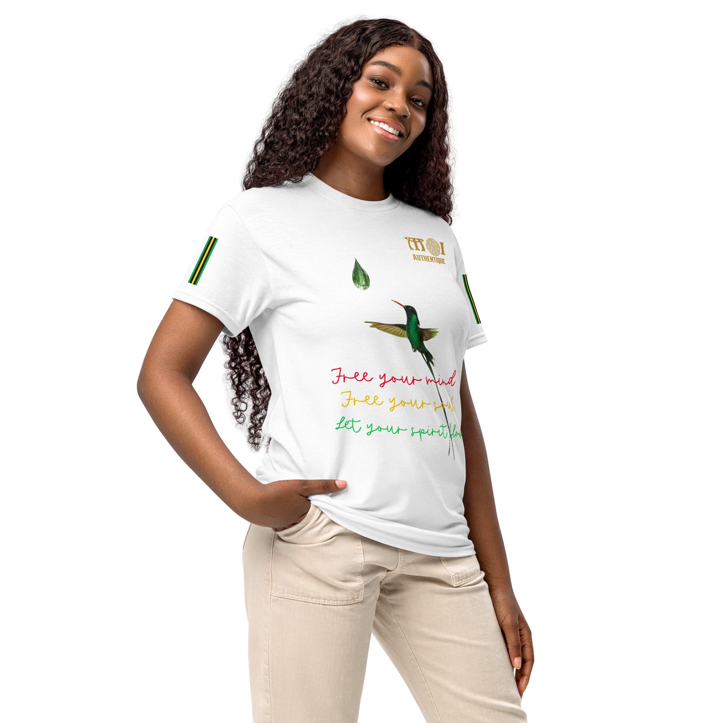 A smiling woman wearing a white t-shirt with colourful writing.