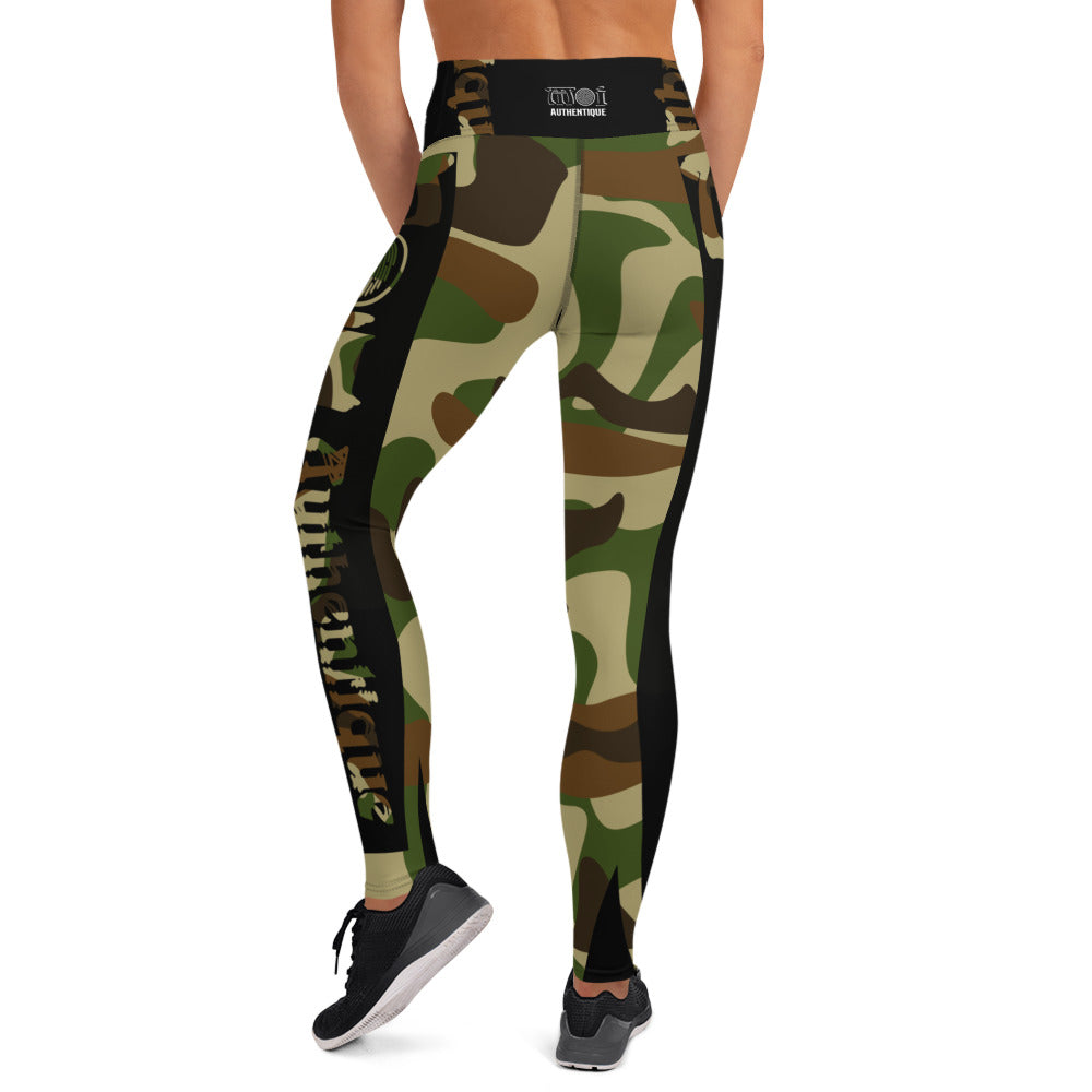 A person in a yoga pose wearing camouflage-patterned yoga leggings.