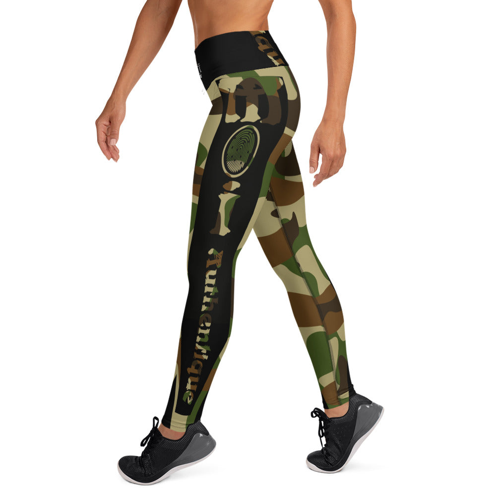 A person in a yoga pose wearing camouflage-patterned yoga leggings.