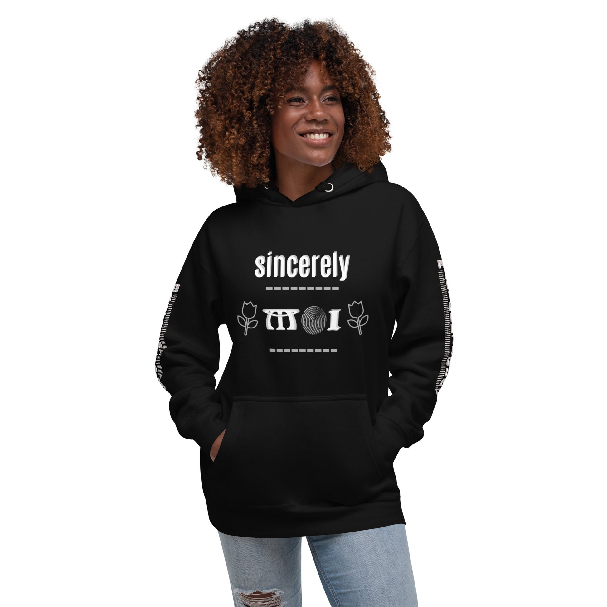 A woman wearing a black unisex hoodie with a front pouch pocket and drawstrings, standing against a white background.