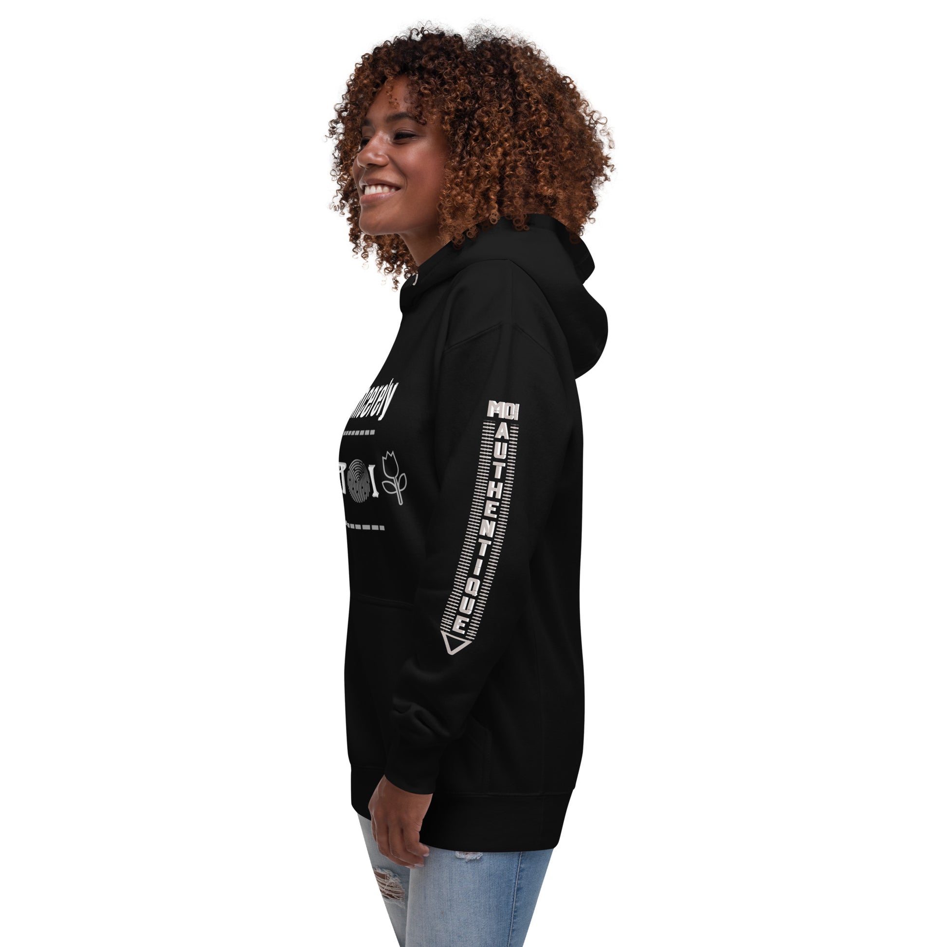 Side view of a woman wearing a black unisex hoodie with a front pouch pocket and drawstrings, standing against a white background.