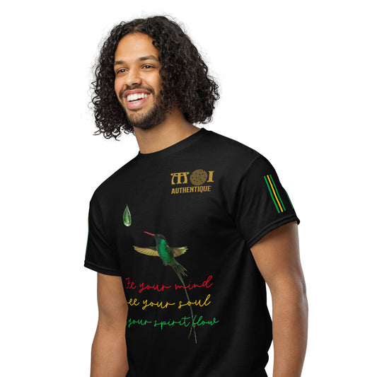A smiling person with short hair wearing a black Unisex DryBlend T-Shirt with colourful text and graphics on it.