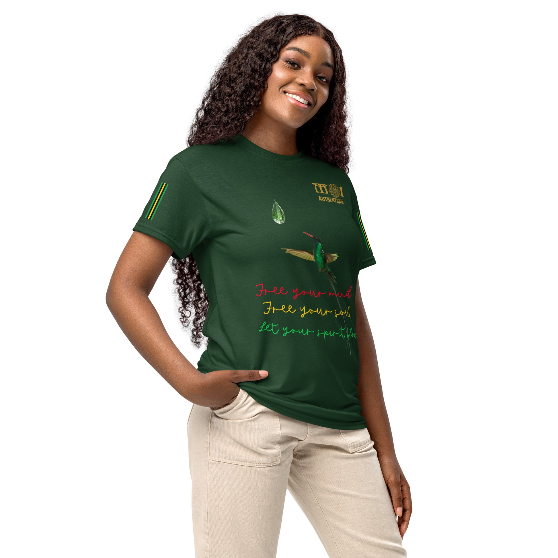 A smiling woman wearing a green t-shirt with colourful writing.