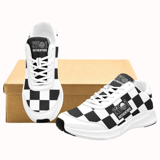 A pair of Moi Authentique Women's 2-Tone Skanking Sneakers with a black and white checkered design, displayed alongside a brown box.